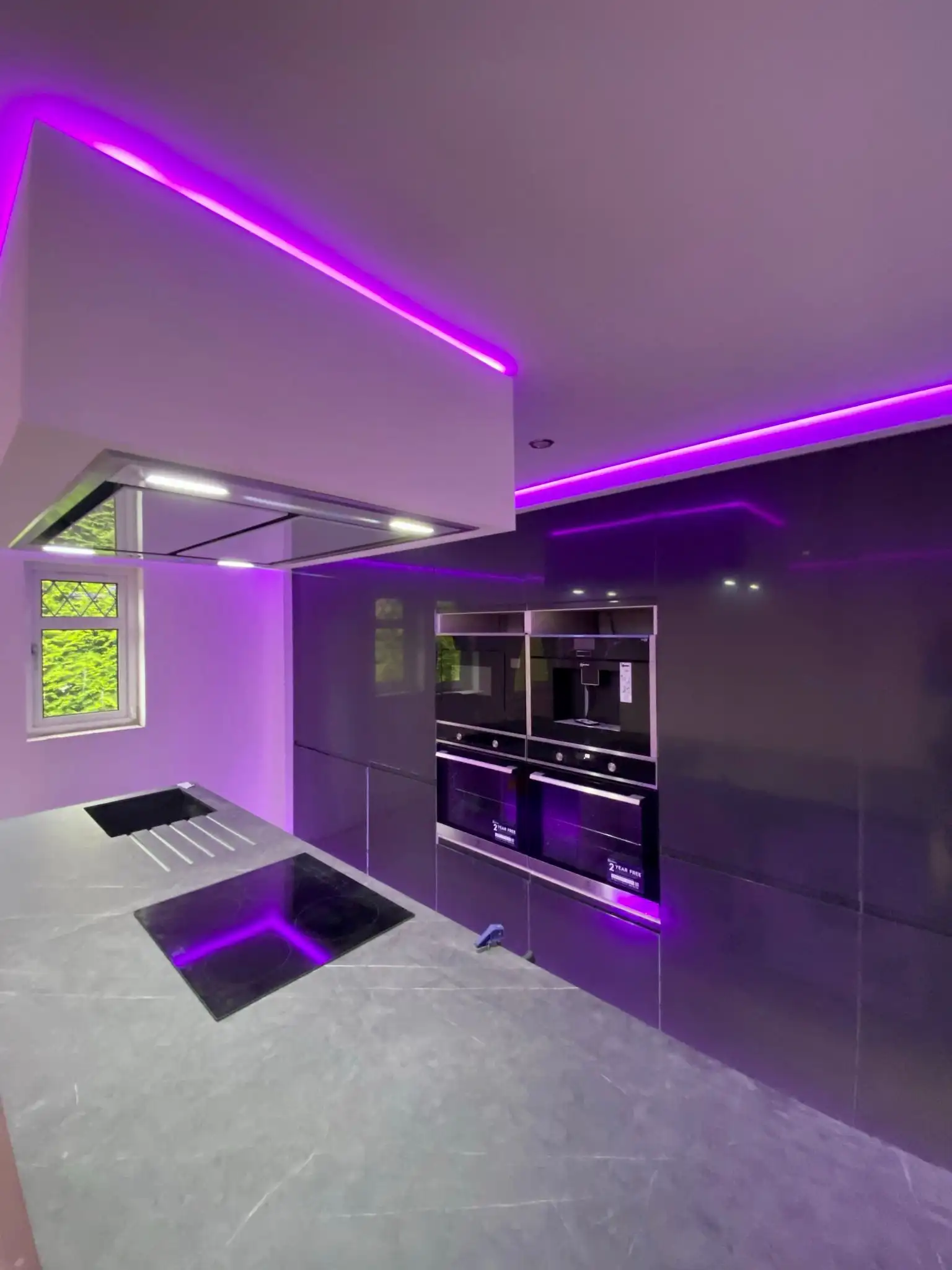 Modern gloss kitchen display at Rena Interiors showroom, Falkirk
